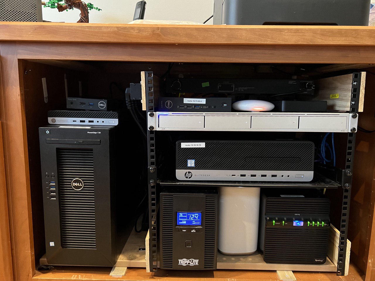 Cabinet under desk with a home-built equipment rack and way too much gear